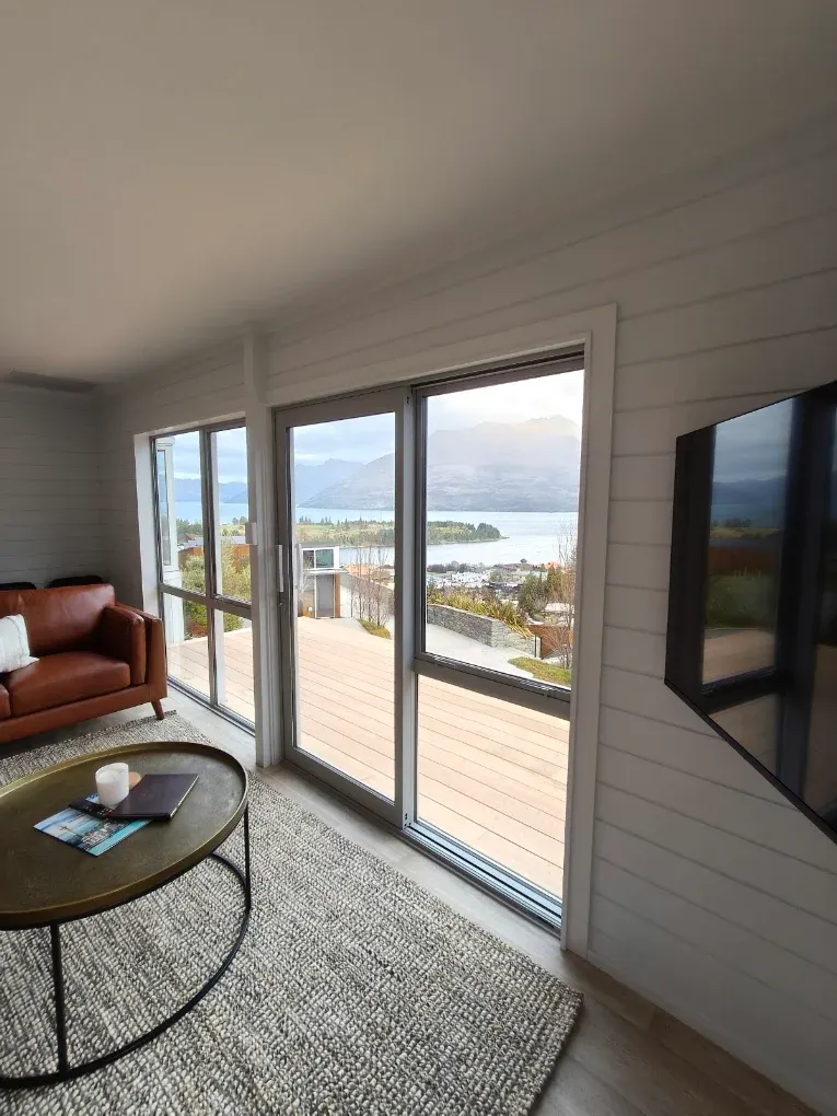 Interior repaint in a living room looking over the lake
